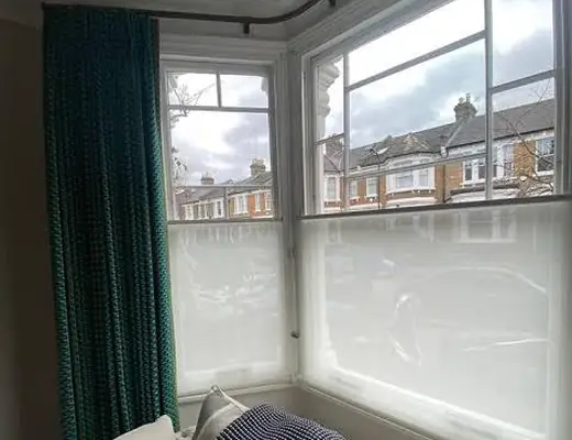 Top-down bottom-up shades in a bay window