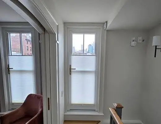 Top-down bottom-up shades in a stair landing